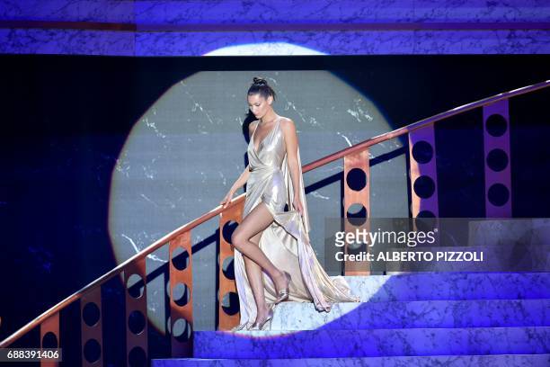 Model Bella Hadid arrives to conduct an auction during the amfAR's 24th Cinema Against AIDS Gala on May 25, 2017 at the Hotel du Cap-Eden-Roc in Cap...