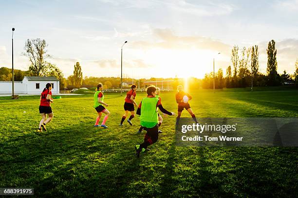 female rugby team training outdoors - grittywomantrend stock pictures, royalty-free photos & images