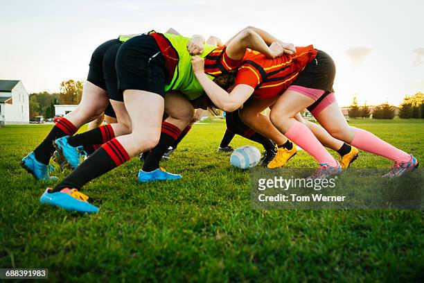 female rugby team training how to block - female rugby team stock pictures, royalty-free photos & images