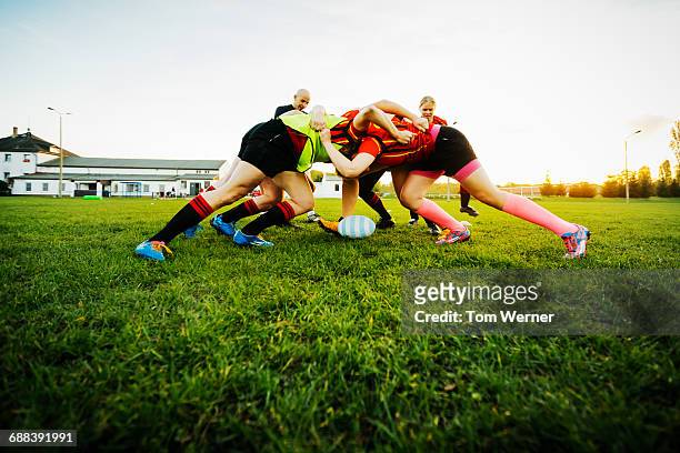 female rugby team training how to block - female rugby stock pictures, royalty-free photos & images