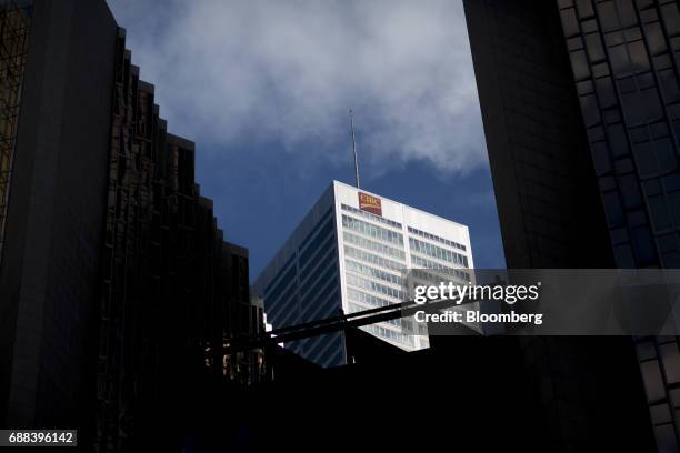 Signage is displayed on the exterior of the Canadian Imperial Bank of Commerce headquarters building in Toronto, Ontario, Canada, on Friday, May 19,...