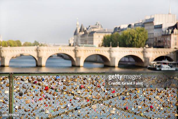 fence with locks. - pont des arts padlocks stock pictures, royalty-free photos & images