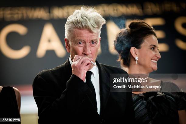 Director David Lynch smokes a cigarette as he attends the "Twin Peaks" screening during the 70th annual Cannes Film Festival at Palais des Festivals...