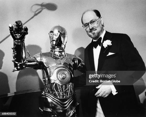 Conductor John Williams poses with C3P0 at a press conference after the Boston Pops on April 29, 1980.