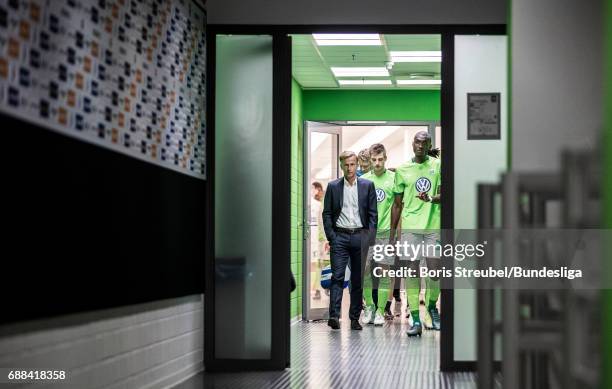 Head coach Andries Jonker of VfL Wolfsburg and his players of VfL Wolfsburg enter the pitch for the second half during the Bundesliga Playoff Leg 1...