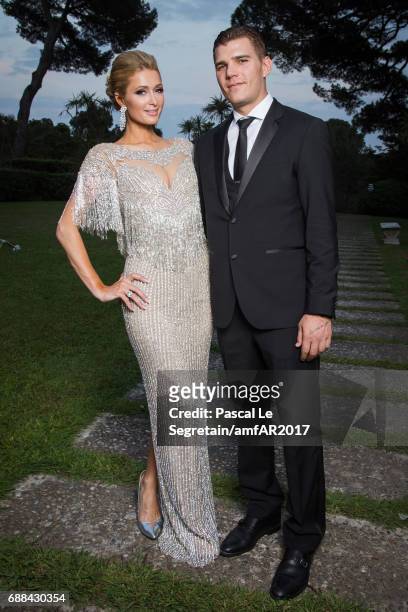 Paris Hilton and Chris Zylka attend the amfAR Gala Cannes 2017 at Hotel du Cap-Eden-Roc on May 25, 2017 in Cap d'Antibes, France.