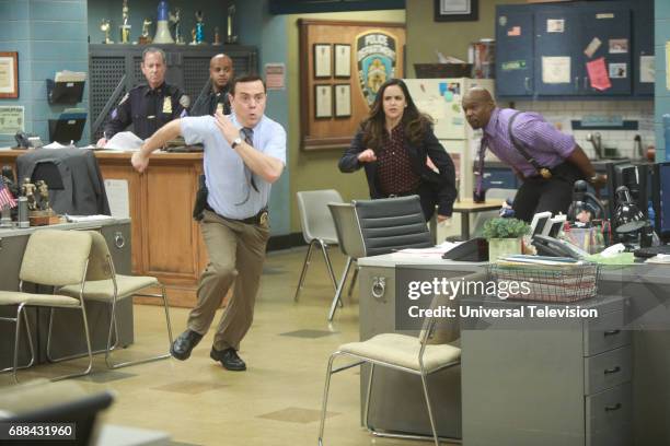 Bank Job" Episode 421 -- Pictured: Joe Lo Truglio as Charles Boyle, Melissa Fumero as Amy Santiago, Terry Crews as Terry Jeffords --