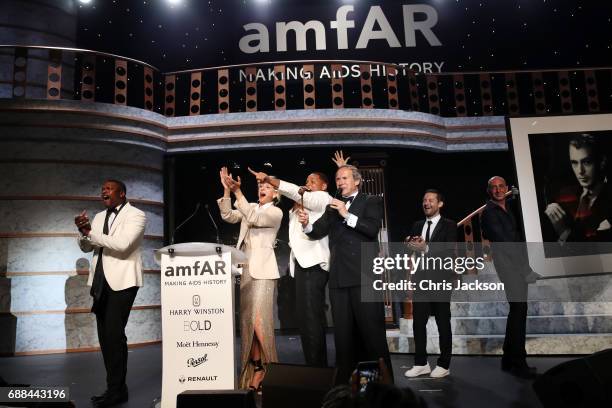 Chris Tucker, Uma Thurman, Will Smith, Jessica Chastain, Tobey Maguire and auctioner Simon De Pury on stage at the amfAR Gala Cannes 2017 at Hotel du...