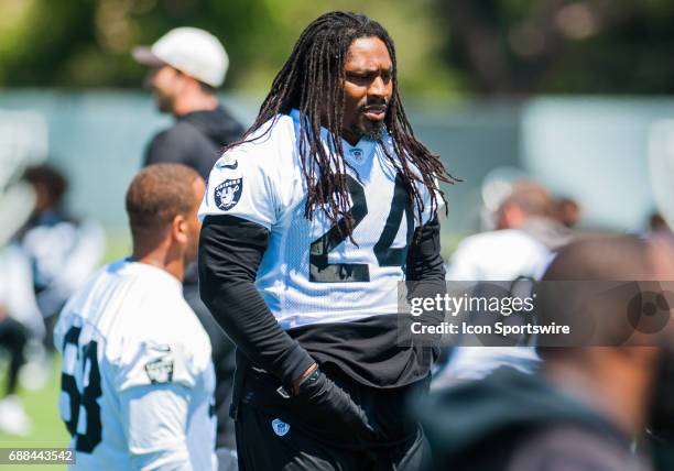 Oakland Raiders running back Marshawn Lynch appears to be in good spirits during the Oakland Raiders OTA at the Raiders Training Facility in...