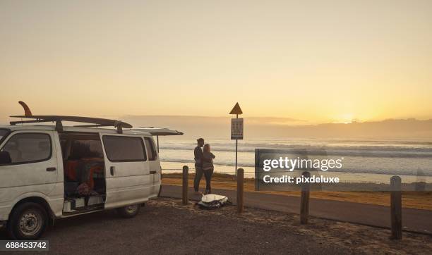 adventuring through the world together - surfer by the beach australia stock pictures, royalty-free photos & images