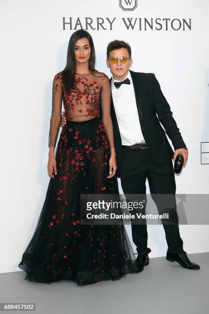 Gizele Oliveira and guest arrive at the amfAR Gala Cannes 2017 at Hotel du Cap-Eden-Roc on May 25, 2017 in Cap d'Antibes, France.