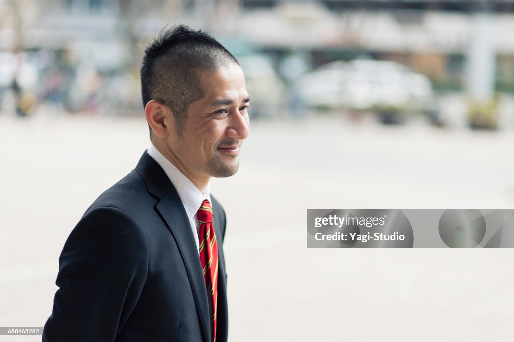 Mature man relaxing in the city.