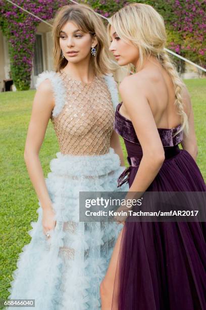 Camila Morrone and Hailey Baldwin attend the amfAR Gala Cannes 2017 at Hotel du Cap-Eden-Roc on May 25, 2017 in Cap d'Antibes, France.