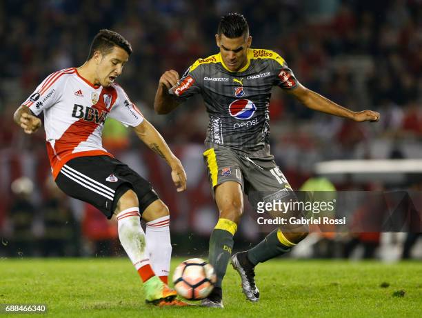 Sebastian Driussi of River Plate fights for the ball with Juan Saiz of Independiente Medellin during a group stage match between River Plate and...