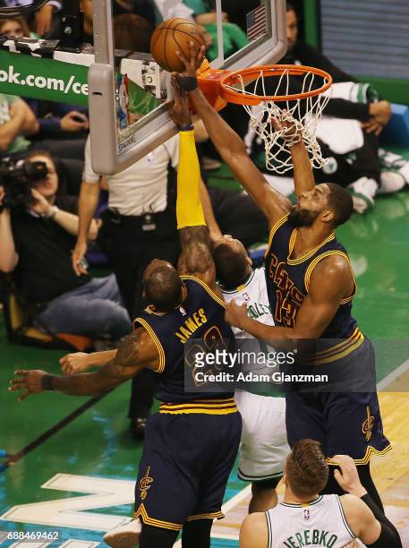 LeBron James and Tristan Thompson of the Cleveland Cavaliers block the shot of Avery Bradley of the Boston Celtics in the first half during Game Five...