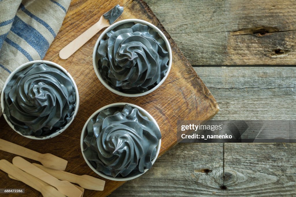 Black ice cream in white cups