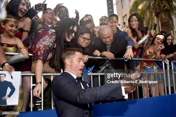 Actor Chris Pine takes a selfie with fans at the premiere of Warner Bros. Pictures' "Wonder Woman" at the Pantages Theatre on May 25, 2017 in...