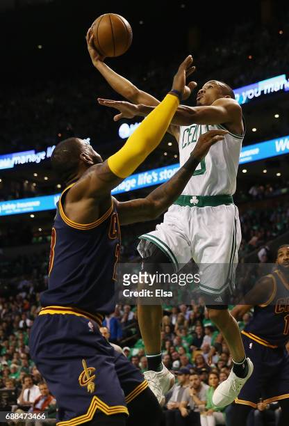 Avery Bradley of the Boston Celtics drives to the basket against LeBron James of the Cleveland Cavaliers in the first half during Game Five of the...
