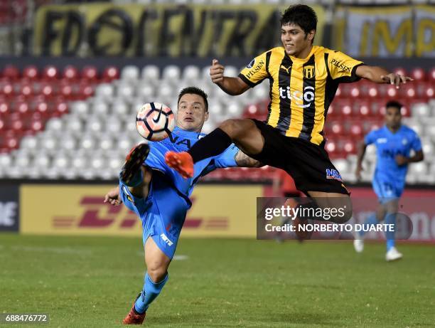 Chile's Deportes Iquique player Alvaro Ramos vies for the ball with Robert Rojas of Paraguay's Guarani during their Copa Libertadores football match...