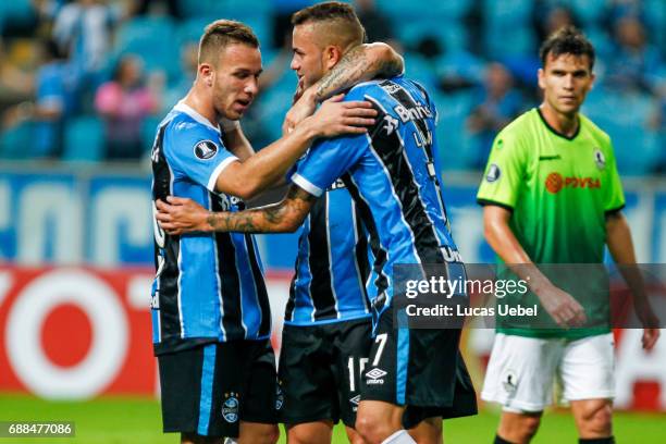 Players of Gremio celebrate their third goal during the match Gremio v Zamora as part of Copa Bridgestone Libertadores 2017, at Arena do Gremio on...