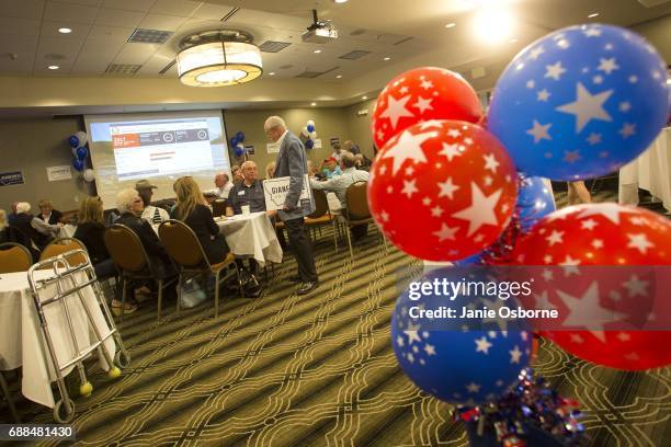 Guests at Republican Greg Gianforte's election party wait to hear the outcome in Montana's special House election against Democrat Rob Quist at the...