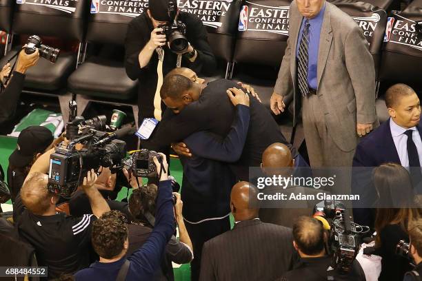 Isaiah Thomas of the Boston Celtics hugs LeBron James of the Cleveland Cavaliers after the Cavaliers defeated the Celtics 135-102 in Game Five of the...