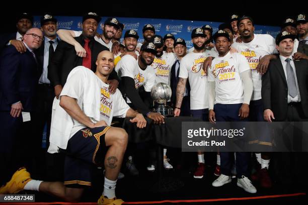 The Cleveland Cavaliers pose with the Eastern Conference Championship Trophy after defeating the Boston Celtics 135-102 in Game Five of the 2017 NBA...
