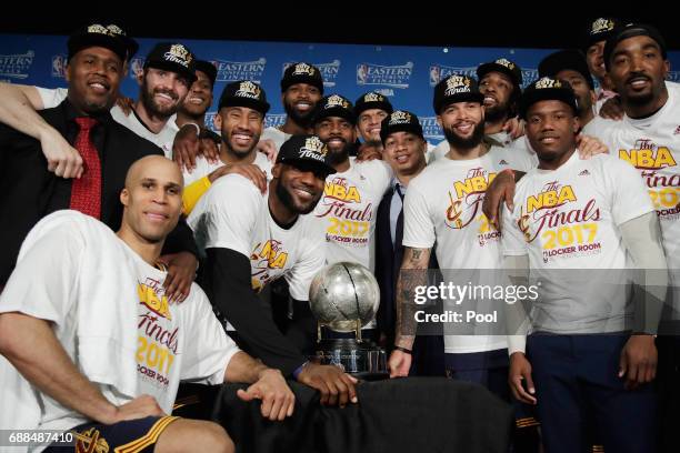 The Cleveland Cavaliers pose with the Eastern Conference Championship Trophy after defeating the Boston Celtics 135-102 in Game Five of the 2017 NBA...