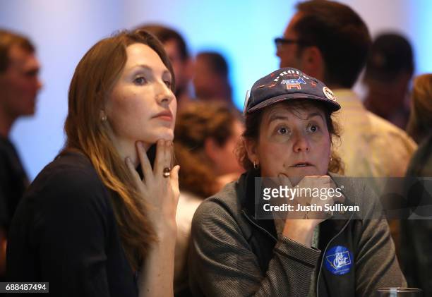 Supporters of Democratic U.S. Congresstional candidate Rob Quist watch election returns during an election night gathering the DoubleTree by Hilton...