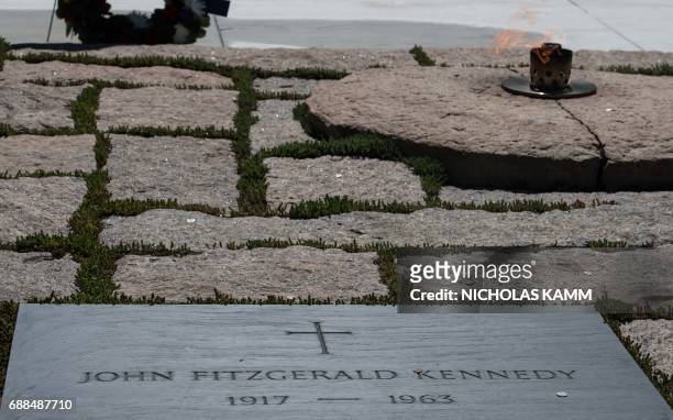 People visit the gravesite of John F. Kennedy at Arlington National Cemetery in Arlington, Virginia, on May 25 ahead of the May 29th birth centennial...