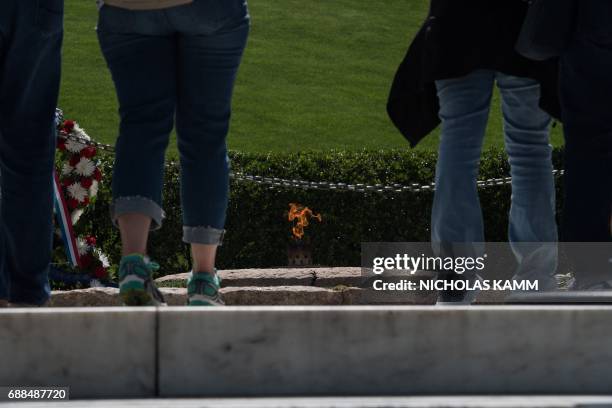 People visit the gravesite of John F. Kennedy at Arlington National Cemetery in Arlington, Virginia, on May 25 ahead of the May 29th birth centennial...