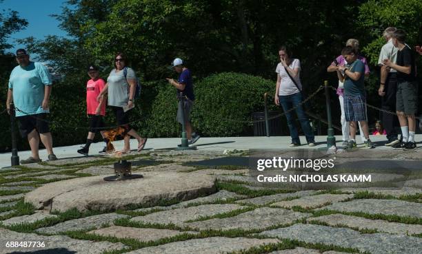 People visit the gravesite of John F. Kennedy at Arlington National Cemetery in Arlington, Virginia, on May 25 ahead of the May 29th birth centennial...