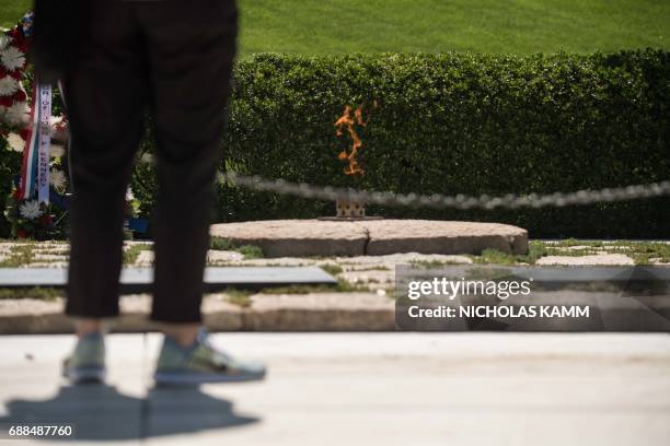 People visit the gravesite of John F. Kennedy at Arlington National Cemetery in Arlington, Virginia, on May 25 ahead of the May 29th birth centennial...