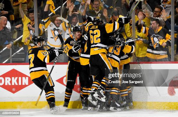 Chris Kunitz of the Pittsburgh Penguins celebrates his game winning overtime goal against the Ottawa Senators in Game Seven of the Eastern Conference...