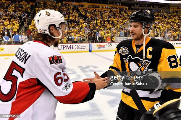 Erik Karlsson of the Ottawa Senators congratulates Sidney Crosby of the Pittsburgh Penguins after winning Game Seven of the Eastern Conference Final...