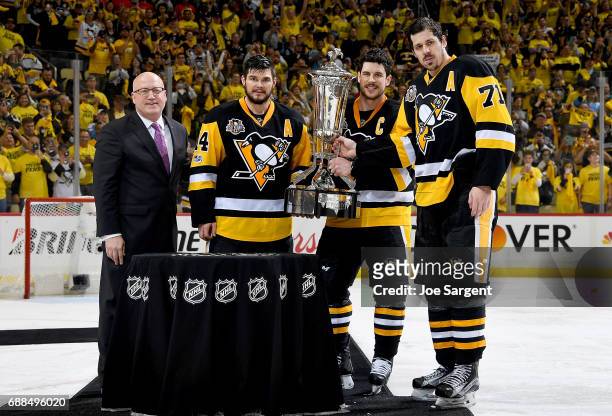 Bill Daley, Chris Kunitz, Sidney Crosby and Evgeni Malkin of the Pittsburgh Penguins pose with the Prince of Whales Trophy after defeating the Ottawa...