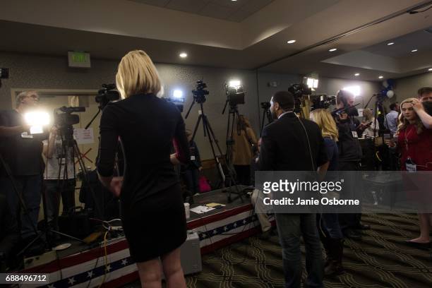 Media prepare to file reports at Republican Greg Gianforte's election party as guests wait to hear the outcome in Montana's special House election...