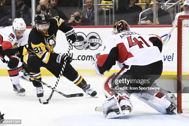 Pittsburgh Penguins Right Wing Phil Kessel puts a shot on Ottawa Senators goalie Craig Anderson during the first overtime period in Game Seven of the...