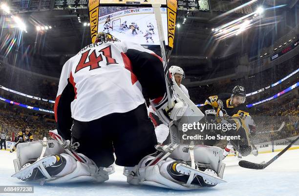 Craig Anderson of the Ottawa Senators protects the net against Conor Sheary of the Pittsburgh Penguins in Game Seven of the Eastern Conference Final...