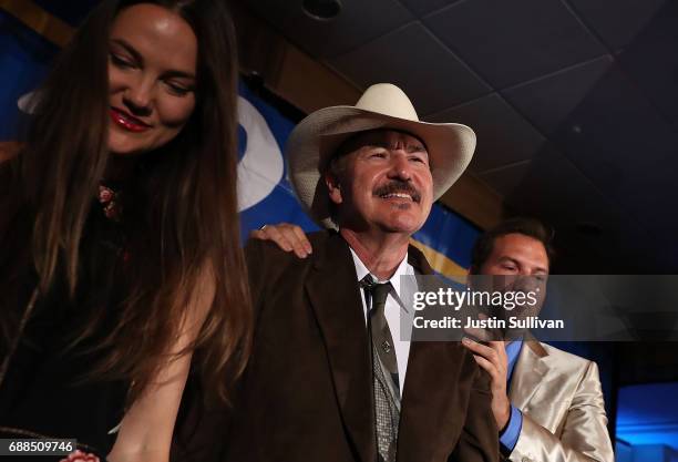 Democratic U.S. Congresstional candidate Rob Quist is is surrounded by his son Guthrie Quist and daughter Halladay Quist after dlivering his...