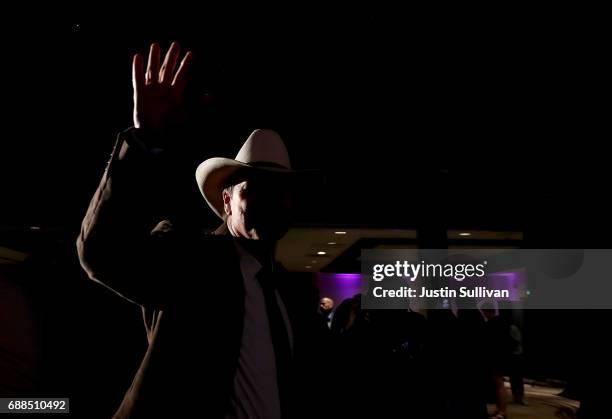 Democratic U.S. Congresstional candidate Rob Quist waves to supporters before delivering his concession speech to supporters at the DoubleTree by...