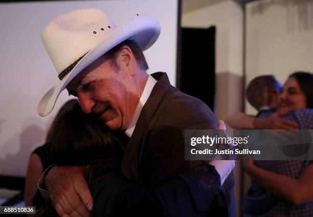 Democratic U.S. Congresstional candidate Rob Quist hugs a supporter after delivering his concession speech at the DoubleTree by Hilton Hotel...