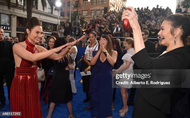 Actors Gal Gadot and Lynda Carter attend the premiere of Warner Bros. Pictures' "Wonder Woman" at the Pantages Theatre on May 25, 2017 in Hollywood,...