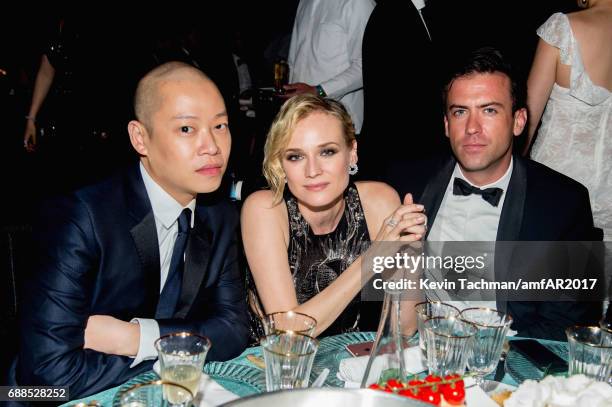 Jason Wu, Diane Kruger and guest attend the amfAR Gala Cannes 2017 at Hotel du Cap-Eden-Roc on May 25, 2017 in Cap d'Antibes, France.