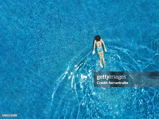 little girl swimming - aerial view people swimming pool stock pictures, royalty-free photos & images
