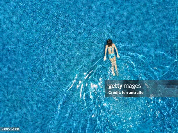 little girl swimming - swimming pool top view stock pictures, royalty-free photos & images