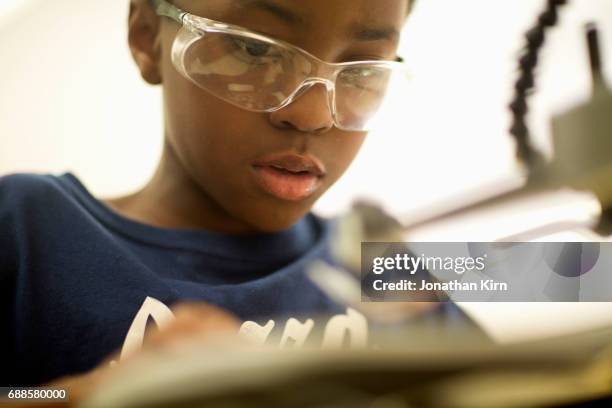 fourth grade boy in class. - eye protection stock pictures, royalty-free photos & images