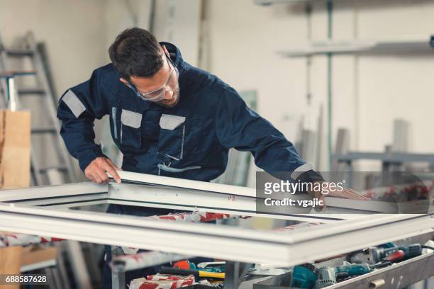 aluminium and pvc industry worker - window stock pictures, royalty-free photos & images