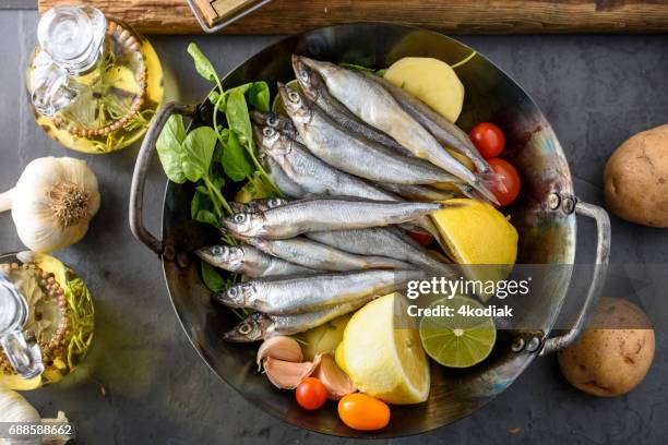 fresh sardines in wok - sardinas stock pictures, royalty-free photos & images