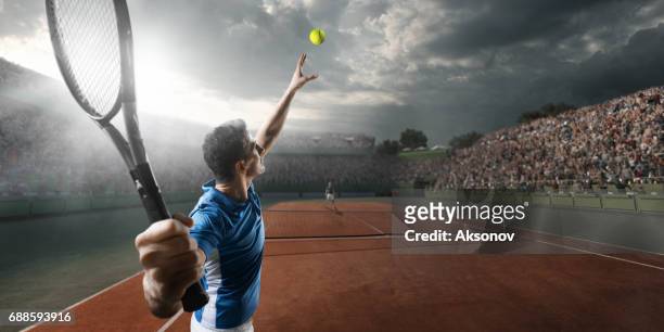 tennis: male sportsman in action - tennis stock pictures, royalty-free photos & images